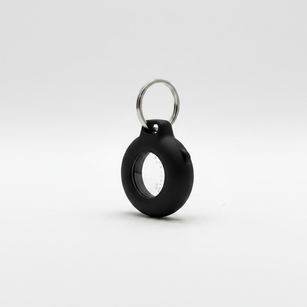 Custodia protettiva nera in silicone per AirTag con portachiavi in metallo, venduta da Mr Bob - Home & Tech Utility